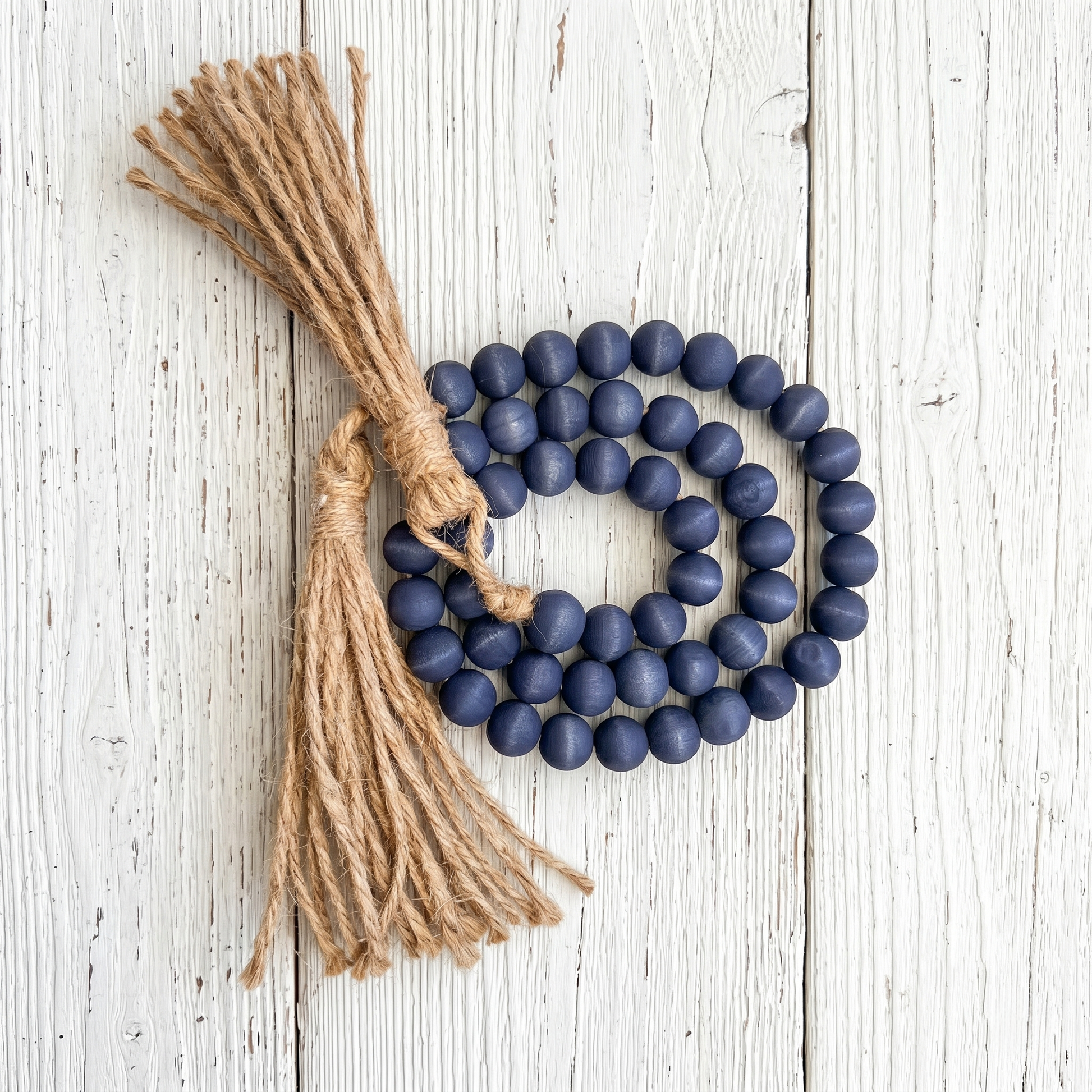 Navy Blue Wood Bead Garland (4) on whitewash wood background